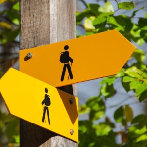 yellow road signage at daytime